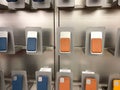 An Apple store display of colorful iPhone Magsafe Wallets and cases