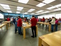 An Apple store with people waiting to purchase Apple Macbooks, iPads and iPhones Royalty Free Stock Photo