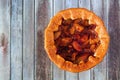 Apple strawberry autumn pie, top view on a rustic gray wood background