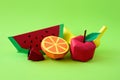 Apple, strawberry, banana, orange and watermelon made from paper on green background. Fresh fruits. Minimal, creative, vegan, Royalty Free Stock Photo
