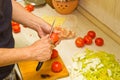 Male hands preparing vegetable dish