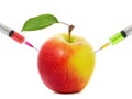 Apple stuck with syringe, Concept of genetic modification of fruits Royalty Free Stock Photo