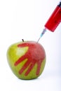 Apple with syringe