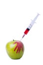 Apple with syringe