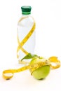 Apple, tape and a bottle of water Royalty Free Stock Photo