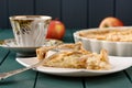 Apple tart with cup of tea and three whole apples Royalty Free Stock Photo
