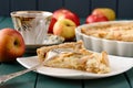 Apple tart with cup of tea and whole apples Royalty Free Stock Photo