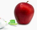 Apple, thothbrush, toothpaste on white Royalty Free Stock Photo