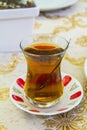 Apple Turkish tea in a traditional cup in a cafe Royalty Free Stock Photo