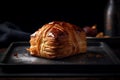 Apple turnover with a touch of cinnamon on a modern black plate, chaussons aux pommes, French puff pastry Generative AI