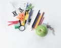 Apple and variety of school supplies on white background.photo with copy space Royalty Free Stock Photo