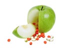 Apple with vitamin capsules