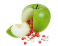 Apple with vitamin capsules