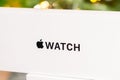 Apple watch box with Christmas tree on the background Royalty Free Stock Photo