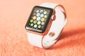 Apple Watch Gold on a soft fluffy peach-colored background