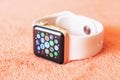 Apple Watch Gold on a soft fluffy peach-colored background Royalty Free Stock Photo