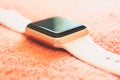 Apple Watch Gold on a soft fluffy peach-colored background