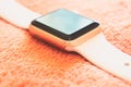 Apple Watch Gold on a soft fluffy peach-colored background