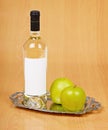 Apple wine in closed bottle on tray Royalty Free Stock Photo