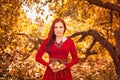 Apple woman. Very beautiful ethnic model eating red apple in the park. Royalty Free Stock Photo