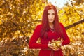 Apple woman. Very beautiful ethnic model eating red apple in the park. Royalty Free Stock Photo