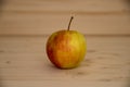 Apple on wooden background close-up