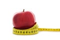 Apple with yellow measuring tape Royalty Free Stock Photo