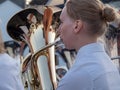 APPLEDORE, DEVON, ENGLAND - AUGUST 29 2021: Young woman playing the tuba in a brass band, outdoors. Royalty Free Stock Photo