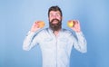 Apples antioxidant compounds responsible health benefits. Nutritional choice. Man with beard hipster hold apple fruit in