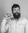 Apples antioxidant compounds responsible health benefits. Nutritional choice. Man with beard hipster hold apple fruit in