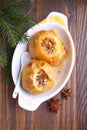 Apples baked with honey and nuts in a white plate Royalty Free Stock Photo