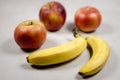 Apples and Bananas on a Gray White Grey Marble Slate Background Royalty Free Stock Photo