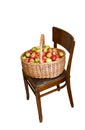 Apples in basket at chair Royalty Free Stock Photo