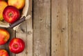 Apples with basket, side border on rustic aged wood