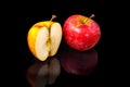 Apples on black wavy mirror. Royalty Free Stock Photo