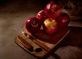 Apples board. Apples and a knife are on a cutting board and the whole composition with a dark background