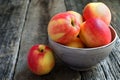 Apples in a bowl on a wooden background