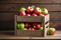 Apples in a box on a wooden shelf. A framework on a wooden background Royalty Free Stock Photo