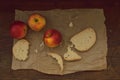 Apples on brown paper on wood. Vintage look