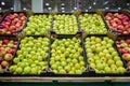 Apples in the cardboard boxes on the grocery shelf