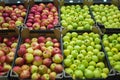 Apples in the cardboard boxes on the grocery shelf