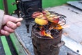 Apples cooking on a wooden stove on an old, vintage wood stove, in flames