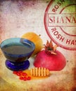 Apples, cut red pomegranate and honey on the old paper texture. Jewish New Year Rosh Hashanah symbols. Shana Tova round stamp