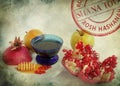 Apples, cut red pomegranate and honey on the old paper texture. Jewish New Year Rosh Hashanah symbols. Shana Tova round stamp