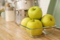 Apples in fruit bowl on countertop in kitchen. Interior element Royalty Free Stock Photo