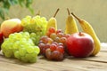 Apples grapes and pears, wooden table Royalty Free Stock Photo