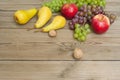 Apples grapes and pears, wooden table Royalty Free Stock Photo