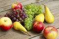 Apples grapes and pears, wooden table Royalty Free Stock Photo