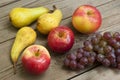 Apples grapes and pears, wooden table Royalty Free Stock Photo