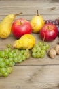 Apples grapes and pears, wooden table Royalty Free Stock Photo